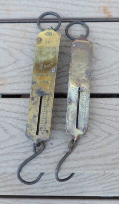 Two antique hanging scales, both of which work well.